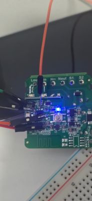 PCB with BK7231N module, connected via jumper wires to a breadboard