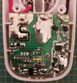 PCB of Wi-Fi Schuko Plug Printed circuit board of a device with a Wi-Fi Schuko plug, showing a green board with electronic components.
