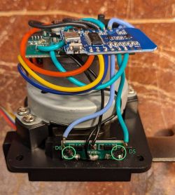 Close-up of PCB boards with multicolored wires mounted on a motor; D5 and D6 circled and labeled.