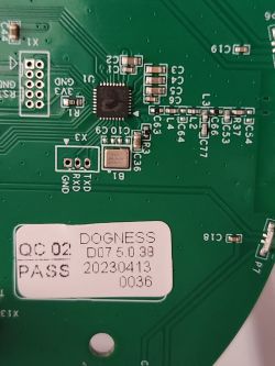 Circuit Board with Dogness Microchip Image of a circuit board with a microchip and a sticker with information.