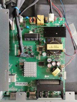TV motherboard with visible electronic components.