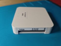 Plastic enclosure of a device with pin labels on the side.