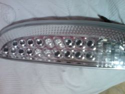 Opel corsa c 1.2 80km - Jak wymienić oświetlnie w tylnej lampie samochodu?