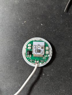 Interior of an electronic device with a visible CBU module and a soldered USB-A cable.