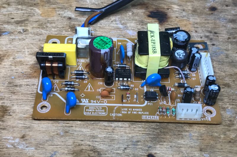 Circuit Board with Electronic Components Circuit board with electronic components including capacitors, coils, and resistors.