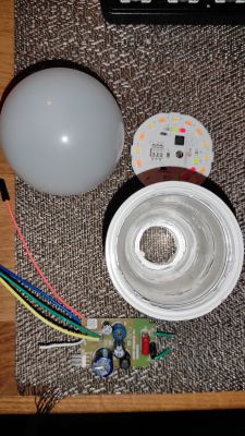Disassembled Spectrum Smart LED Bulb Disassembled smart LED bulb with visible internal components.