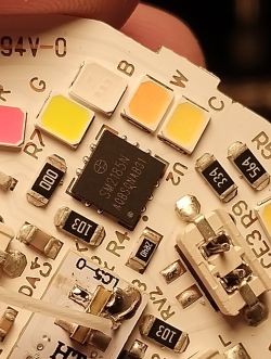 Close-up of SM2185N chip on LED driver board with labeled RGB and white LEDs
