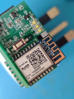 Broadlink Wi-Fi module with electronic components on a green PCB board