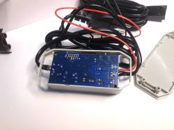 ATLO-GDC2-TUYA Garage Door Controller - Interior View ATLO-GDC2-TUYA garage door controller opened, showing the PCB and connected wires.