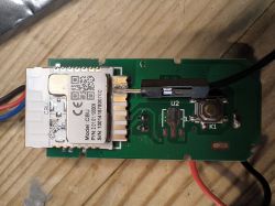 Circuit Board with CBU Module and Connectors Circuit board with CBU module, button, and connected cable.