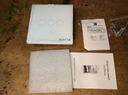 AVATTO TS02-EU-W3 Set on Table AVATTO light switch set with instructions and accessories on a table.