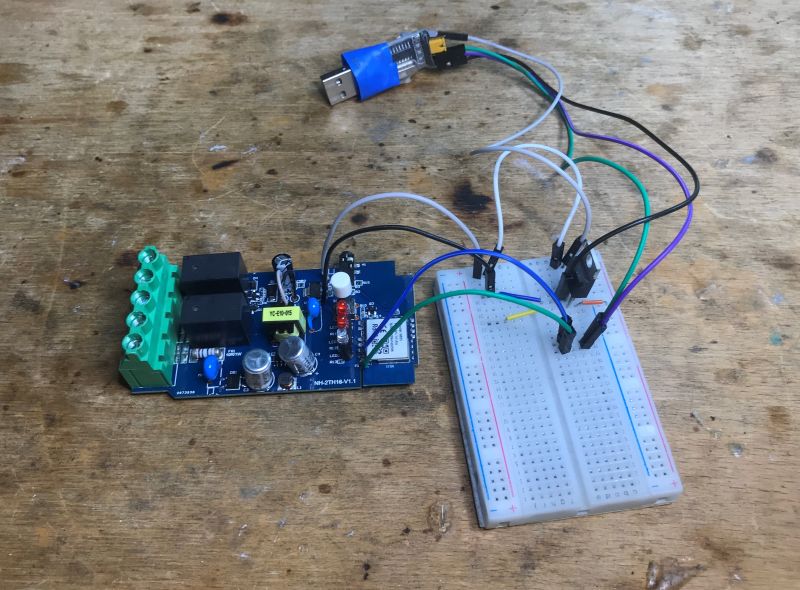 Moes MS-103 Relay with Temperature Sensor and Manual Close-up of the Moes MS-103 programmable relay with attached temperature probe and included manual.