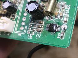 Close-up of U1 integrated circuit on green PCB with SMD components