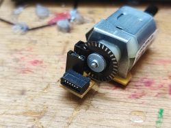 DC Motor with Encoder from Inkjet Printer DC motor from a printer with a visible encoder.