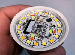 Circular printed circuit board with LED lights.