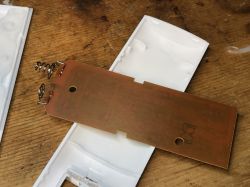 Interior of a ceiling lamp remote control with PCB and springs.