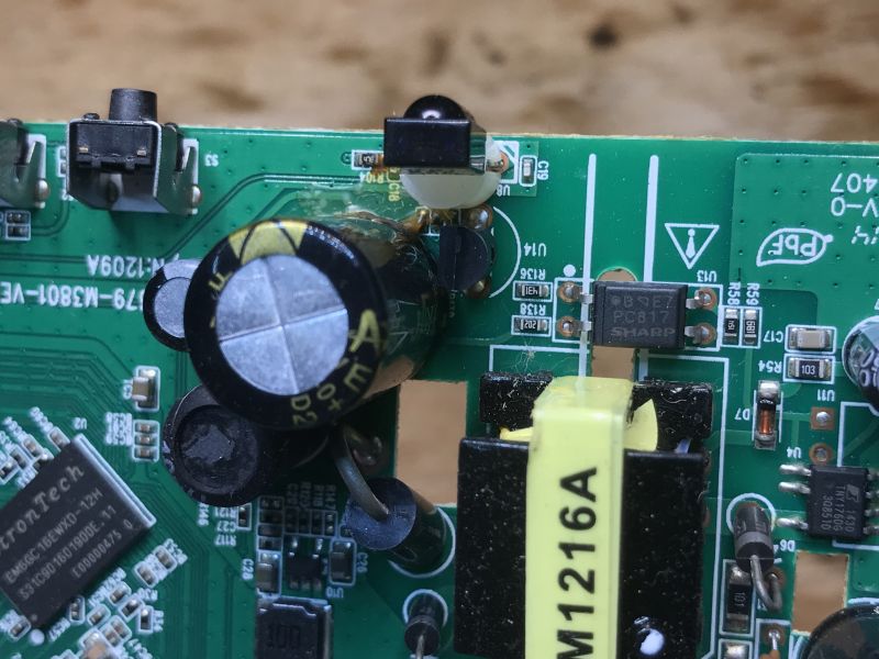 Close-up of tuner power section showing capacitors and PC817 optocoupler