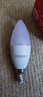 Eveready smart bulb SES/E14 lying on a carpet
