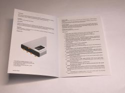 Open power bank manual showing port diagram and usage warnings in Polish