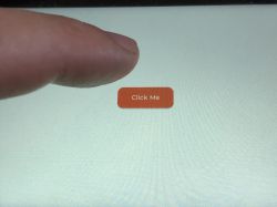 Touch Button Test on ESP32-S3-Touch-LCD-5 Display A finger approaching an orange button labeled Click Me on a touchscreen.