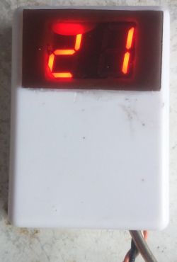 Thermometer with red LED display showing 21°C