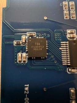 Close-up of a circuit board with a T34 microcontroller visible.