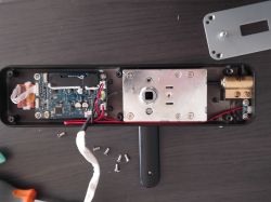Dismantled Lemaar Smart Lock Dismantled Lemaar smart lock with visible electronic and mechanical components.
