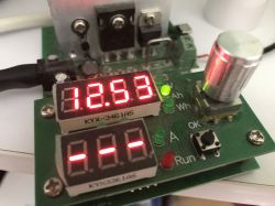 Electronic PCB with red LED display reading 12.53 and indicator LEDs labeled Ah and Wh
