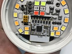 Inside eWeLink Zigbee LED Bulb with BL702 Module View of the opened eWeLink LED bulb showing the BL702 module and electronic components on the circuit board.