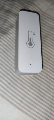 TH01 Temperature and Humidity Sensor External view of the TH01 temperature and humidity sensor in a white casing.