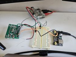 DETA Grid Connect Board with Connections DETA Grid Connect Smart Inline Switch board with connected wires on a table.