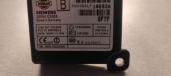 Close-up of a Siemens/Nissan electronic module label with serial numbers and certification symbols.