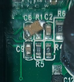 PCB section with a manually soldered 100nF capacitor between labeled points C6 and C2