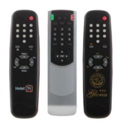 Three black universal remote controls with number and arrow buttons standing upright