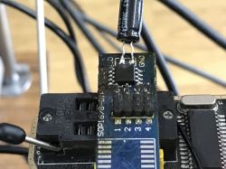 Close-up of an electronic module with an added electrolytic capacitor.