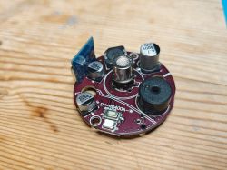 Tuya DY-RQ400A-W module on a wooden table.