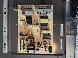 TV Power Supply Board – Internal View Power supply board inside a TV with various electronic components.