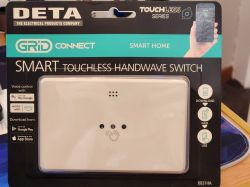 Deta Grid Connect touchless hand switch in original packaging.
