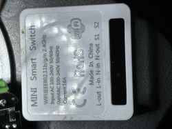 Label on a “MINI Smart Switch” module with Wi‑Fi, power specs, and terminal markings.