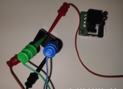 Connected circuit board with colored wires and PogoPin adapter.