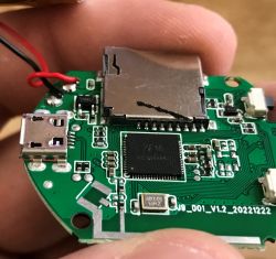 Close-up of a PCB with XF16 chip, microSD slot, and micro USB port