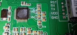Electronic Circuit Board with Markings and Soldered Components Electronic circuit board with markings RST, RX, TX, VDD, GND, and various soldered components