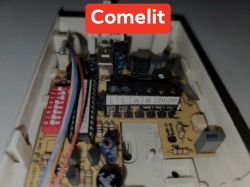 Comelit Intercom Terminal Board Close-up of a Comelit intercom circuit board with connected wires and terminal labels L, L, A, B, CFP, CFP.