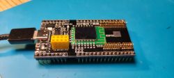 ESP32 module connected to a circuit board.
