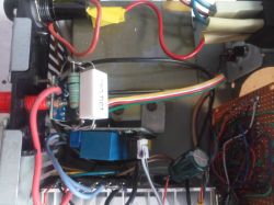 Interior of a rectifier showing wires, resistor, and transformer windings