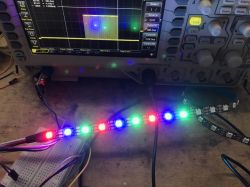 WS2812B LED strip connected to an oscilloscope, showing display irregularity.
