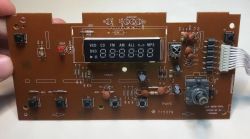 Control board from micro stereo with 7-segment display, buttons, and input connector