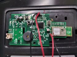 Opened IRIS Hardware Key with Electronic Components Close-up of an opened IRIS hardware key with visible electronic components and wiring.