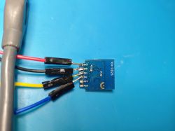 Sparkle XH-CB2S Module with Wires Sparkle XH-CB2S module with wires connected to pins on a blue board.
