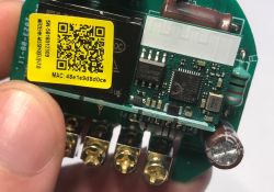 Circuit board with microcontroller, QR code label, and screw terminal connectors